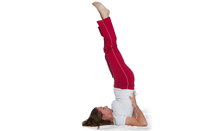 Woman practice variation of sarvangasana yoga pose Stock Photo by  ©iakovenko123 272205146